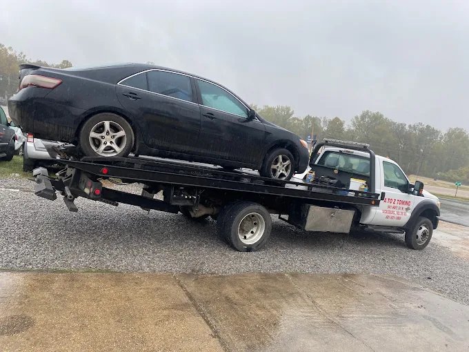 Toyota Camry being transported by A to Z Towing
